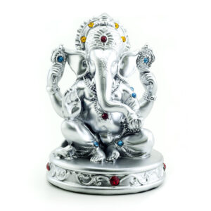 Gilded figure of the elephant Ganesha on white background
